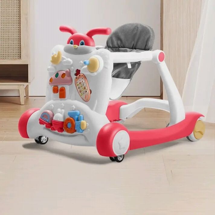 Children's toy scooter with colorful design on a light wooden floor.
