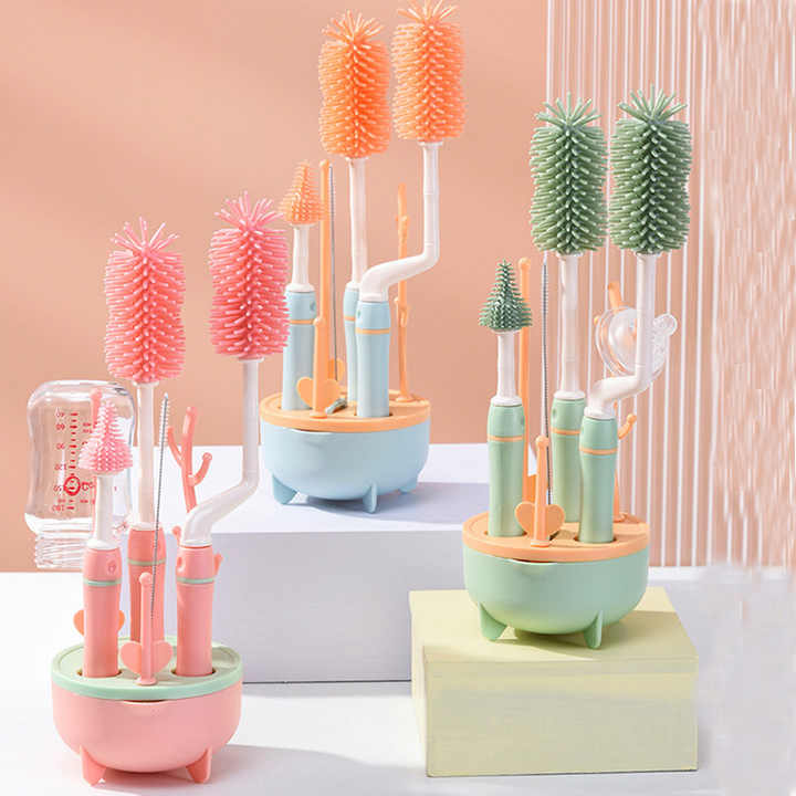 Set of colorful bottle brushes in stands on a light background